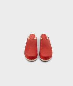 Elevate your everyday style with our minimalist clog mule, featuring clean lines and a timeless aesthetic that effortlessly transitions from day to night. Clog measurements:Heel height: 1 3/4” (4.5 cm)Toe height: 1 5/8″ (4.1 cm) Fit:RegularLeather:Nubuck leather Clogs consist of:Base: European Lime Wood Sole: Rubber sole Fastening: Staples Classic Everyday Slip-on Clogs, Classic Clogs With Leather Sole For Everyday, Clogs With Rubber Sole And Round Toe, Clogs With Removable Insole And Round Toe, Solid Color Slip-on Clogs With Rubber Sole, Everyday Closed Toe Clogs With Rubber Sole, Classic Mules With Wooden Heel, Classic Clogs With Removable Insole, Classic Mules With Rubber Sole And Open Heel