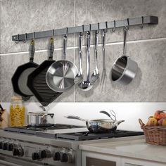 pots and pans are hanging on the wall