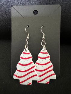 Handcrafted pair of adorable and lightweight earrings. Made of acrylic, stainless steel earring hooks with silicone earring stoppers included. Pendant image is double sided. Pendant measures approximately 1.25 inches x 1.75 inches. Dangle is approximately 2.75 inches. Listing is for 1 pair of earrings. Thank you for shopping with me. White Ear Wire Earrings For Holiday, White Holiday Earrings With Ear Wire, Nickel-free White Earrings For Christmas, Tree Earrings, Christmas Tree Earrings, Earring Tree, White Christmas Tree, Lightweight Earrings, Earrings White