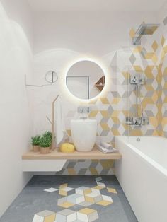 a bathroom with yellow and white tiles on the floor, sink and mirror in it