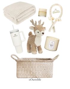 the contents of a baby's gift set including a stuffed animal, bottle and blanket