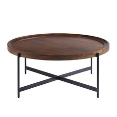 a wooden table with metal legs and a round tray on the top that has an iron base