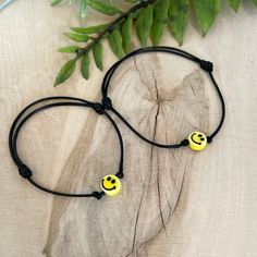 "Delicate boho style bracelet, made of waxed cord and ceramic smiley face charm.  Designed for everyday wear. This minimalist boho bracelet enhance your casual outfit.  ♥ ITEM DETAILS: Total length: The size of the bracelet is adjustable. The bracelet for Adult closes approximately 6\", and the bracelet for girl/boy has an adjustable closure that will fit a 5\" wrist. Materials: Waxed cord bracelets - Ceramic Happy Face Flat Round Charm Charm Color Available: Yellow. Waxed Cord Available: Dark Brown - Light Brown - Black. Waxed Cord Size: 1mm waxed cord.  ♥ GIFT IT Jewelry comes in a cute canvas bag ready to gift! If you wish your item to be a gift, please let me know, and I will include a cute little card with your personal message. ♥ CURRENT PROCESSING TIMES: normally we ship orders out Adjustable Fun Friendship Bracelets For Festivals, Casual Yellow Friendship Bracelets, Adjustable Smiley Face Bracelets As Gift, Casual Adjustable Smiley Face Friendship Bracelets, Casual Adjustable Smiley Face Bracelets, Casual Adjustable Smiley Face Bracelet, Adjustable Smiley Face Bracelet As Gift, Adjustable Smiley Face Jewelry Gift, Smiley Face Adjustable Jewelry For Gifts