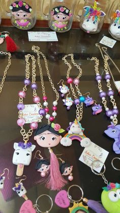 many different key chains are on display for sale