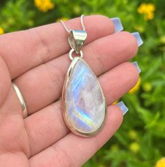 This listing is for one teardrop shape Moonstone sterling silver pendant. Please keep in mind that pendants may vary slightly in shape, size, and flash. If you have a preference please make sure to  leave me a note to seller at checkout. Choose your chain length in the drop down to add a sterling silver chain. 💜Moonstone is a transparent to translucent stone that has a colorless to milky hue. It is typically found showing a reflective optical phenomenon in a pinkish to bluish hue, similar to an opal. This stone was discovered in ancient times. Moonstone was named due to its comparison to the light of the moon. Moonstone is a stone of calmness, hope and new beginnings. It has been thought to increase ones flexibility and allow one to accept the flow of life. This stone also promotes empath Silver Teardrop Gemstones, Silver Pear-shaped Moonstone Jewelry, Spiritual Teardrop Moonstone Jewelry, Moonstone Teardrop Pendant For Healing, Teardrop Silver Gemstones For Jewelry Making, Silver Teardrop Gemstones For Anniversary, Silver Pear-shaped Natural Stone Jewelry, Moonstone Teardrop Pendant Jewelry, Silver Teardrop Natural Gemstones