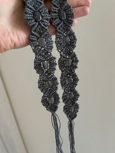 "Beautiful gray macrame belt. Only 1 available in this color and with these beads. The beads are not completely gray, they have a blue-gray color.  Check out the pictures to see how the belt looks like in different lighting.  Measurements:  Total length:  51.5\" Macrame part:  27.5\" Each tassel:  12\" Width: 1.5\" Follow @magnifique.macrame on Instagram!" Bohemian Adjustable Belt For Beach, Bohemian Adjustable Belt For Festivals, Handmade Adjustable Artisan Belt, Adjustable Bohemian Belt For Festivals, Handmade Artisan Adjustable Belt, Macrame Waist Belt, Crochet Black Belt, Adjustable Silver Bohemian Belt, Black And White Macrame