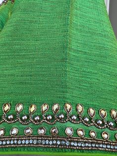 Parrot Green Color Raw Silk Readymade Blouse with beautiful Handwork Work. Item : Readymade BlouseSize : 36 (Can be opened to Size 40)Length of the Blouse : 14 inches Length of the Sleeves : 10 inches Color : Parrot Green Blouse Fabric : Soft Silk Lining : Yes, it is fully lined Padded or Non-Padded : PaddedClosure: Back Closure with hooks.Ready-to-Wear : YesDisclaimer - : -This is a Standard Size blouse. We do not guarantee perfect fit as every body and shape is different. Little or no alterati Elegant Green Tops For Eid, Green Cutdana Blouse For Eid, Semi-stitched Embellished Green Blouse Piece, Green Semi-stitched Embellished Blouse Piece, Embellished Green Blouse Piece For Diwali, Eid Celebration Blouse With Cutdana, Green Blouse With Mirror Work For Eid, Bohemian Blouse With Self Design For Eid, Embellished Green Blouse Piece For Festivals