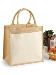 a jute bag with handles is shown next to some bread, wine and other food items