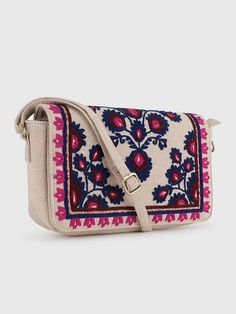 YASMINE SLING BAG – BEIGEHandcrafted Embroidered Sling Bag from India - Stylish and Artfully Designed.Elevate your style with Beige Base Sling Bag featuring intricate Blue Wool Embroidery. This Boho Chic Crossbody Bag combines practicality with a unique Artisan Design. Stand out elegantly with this Floral Embroidered Handbag, perfect for any adventure.- Material: Cotton Canvas (Embroidered)- Dimensions: (H) 6.5“x (W) 10“x (D) 2“- Bag Height including Handle = 29“- Handle Drop = 22.5" (Adjustable Bohemian Beige Shoulder Bag With Floral Embroidery, Multicolor Embroidered Crossbody Shoulder Bag With Adjustable Strap, Multicolor Embroidered Woven Motifs Shoulder Bag For Everyday Use, Multicolor Embroidered Shoulder Bag For Everyday Use, Multicolor Embroidered Floral Crossbody Shoulder Bag, Multicolor Embroidered Crossbody Bag, Multicolor Embroidery Crossbody Shoulder Bag, Multicolor Floral Embroidery Crossbody Shoulder Bag, Bohemian Crossbody Bag With Floral Embroidery