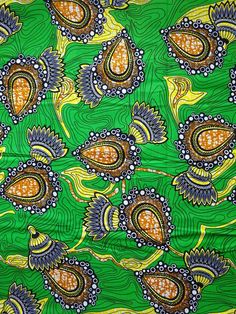 an image of a green and yellow background with paisley designs on the bottom half of it