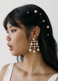 We love a versatile accessory that multitasks, and the Perla Bobby Pins do just that: this set of seven can be worn a few at a time for an everyday pick-me-up, or with multiple sets layered on for a more dramatic finished look. Each pin is crafted by hand in our Brooklyn studio, using opalescent Swarovski pearls of varying sizes. We love the Perla mixed with our Swarovski crystal bobby pins like the Vespera Bobby Pins or the Gemma Bobby Pin. Dimensions: 2.25 x 0.75 x 0.5 inches. Weight: 18g Pearls Hair Accessories, Hairstyles With Pearl Pins, Hair Down With Pearls, Pearl Pins Hairstyles, Pearl On Hair, Pearls In Short Hair, Up Do With Pearls, Bridesmaid Hair Pearls, Long Hair Pearls