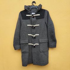 "JW Anderson X Uniqlo Wool Duffle Jacket with Hoodies Size on tag : S (please refer to actual measurement given and compared with your best fitting clothes ) Measurement: (garment laid flat) Width (Armpit to armpit): 19.5\" inches Length (Top shoulder to bottom): 34\" inches Length (shoulder to shoulder): 16\" inches Length (sleeves): 23\" inches Tag : J.W Anderson x Uniqlo Made in : China Material :Polyester/Wool Condition :Used" Hooded Wool Winter Outerwear, Casual Wool Hooded Jacket With Long Sleeves, Casual Wool Hooded Jacket For Fall, Wool Hooded Outerwear With Drawstring, Urban Wool Outerwear For Winter, Winter Outerwear With Toggle Closure For Cold Weather, Winter Workwear Hooded Jacket With Double-lined Hood, Hooded Outerwear With Toggle Closure For Work, Casual Hooded Pea Coat For Work