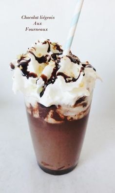 a chocolate milkshake with whipped cream on top