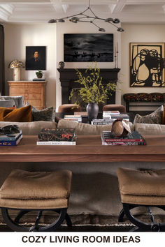 a living room filled with lots of furniture and books on top of a wooden table