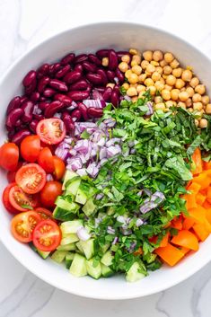 a white bowl filled with different types of vegetables