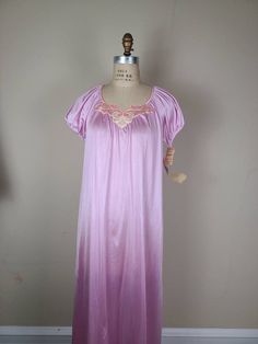 New with original tags from 80s Lilac, pink purple color Made in USA Chest 44 CB 54 Purple Spring Sleepwear For Home, Spring Purple Home Sleepwear, Pink Short Sleeve Nightgown For Pajama Party, Purple Spring Nightgown For Pajama Party, Spring Purple Nightgown For Pajama Party, Purple Nightgown For Pajama Party In Spring, Vintage Pink Sleepwear For Pajama Party, Purple Short Sleeve Nightgown For Bedtime, Purple Short Sleeve Nightgown For Sleepover