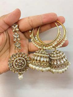 Elevate your style quotient with this gorgeous Mirror hoop earrings set. Made with high-quality materials and crafted with intricate mirror detailing, these mirror jumka hoops are a must-have for any fashion-forward woman who also loves traditional accessories. About this Mirror Hoop Earrings Set - The elegant hoops to fit your everyday attire need - A perfect accessory to wear on any occasion - You can go for these hoop earrings with any ethnic attire - Perfect for jewellery-loving females Dime Bridal Earrings For Wedding And Eid, White Bollywood Hoop Earrings For Celebration, Hand Set Hoop Earrings For Wedding, Elegant Wedding Hoop Danglers, White Hoop Earrings For Diwali, Meenakari Earrings For Marriage And Festivals, White Hoop Earrings For Festive Occasions, Meenakari Chandbali Bridal Earrings, Wedding Chandbalis For Navratri, Drop Earrings Style