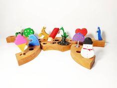 a group of wooden toys sitting on top of a white surface