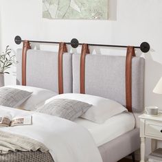 there is a bed with two headboards on it