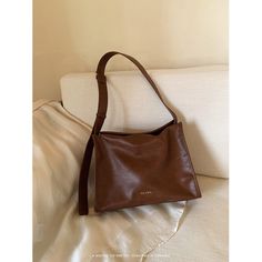 A crossbody bag with a retro design that has a moderately sized rectangular body that is easy to use on a daily basis. It has a distinctive shiny leather feel and has a pocket inside. The length of the shoulder strap can be adjusted. 
 
 
 Color 
 
 Dark brown 
 Black 
 
 
 Size 
 
 
 FREE size 
 
 Height: 22cm 
 Width: 31cm 
 Depth: 11.5cm 
 
 
 
 
 
 Material 
 
 Leather Bag Dark, Retro Design, Easy To Use, Inside Pocket, Free Size, Dark Brown, Crossbody Bag, Shoulder Strap, Leather