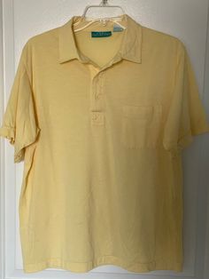 Very nice condition shirt from the 1980s by 615 Collection.  Very light yellow, almost sheer shirt in a very lightweight cotton/polyester blend great for the warmer weather.  The shirt has a pointed collar, four button placard and a left breast pocket.  Marked as a L Chest measures 21" (42 chest) Yellow Short Sleeve Polo Shirt For Spring, Spring Solid Polo Shirt With Collared Neckline, Classic Yellow Polo Shirt For Spring, Yellow Collared Polo Shirt For Summer, Yellow Polo Collar Shirt For Summer, Yellow Polo Collar Top For Spring, Yellow Polo Shirt For Spring, Yellow Spring Polo Shirt, Spring Yellow Polo Shirt