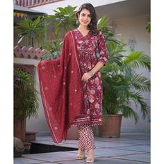 Maroon colored suit is prettified with floral printed work as shown which makes it appear classy. This top is made of pure cotton fabric which is accompanied with pure cotton bottom and chanderi dupatta. Women can buy this suit to wear for their parties and functions. Note:- The actual product may differ slightly in color and design from the one illustrated in the images when compared with computer or mobile screen. Size Chart Size: Semi Stitched/Unstitched can be altered from maximum to minimum Diwali Cotton Silk Kurta With Floral Print, Diwali Cotton Silk Floral Print Kurta, Diwali Floral Cotton Silk Kurta, Anarkali Palazzo Set In Floral Cotton Silk, Anarkali Style Floral Cotton Silk Palazzo Set, Designer Cotton Kurta With Floral Print, Semi-stitched Chanderi Palazzo Set With Floral Print, Chanderi Palazzo Set With Floral Print And Straight Kurta, Bollywood Cotton Silk Sets With Floral Print