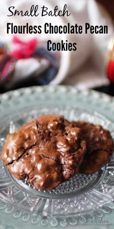 small batch flourless chocolate pecan cookies on a glass plate with text overlay