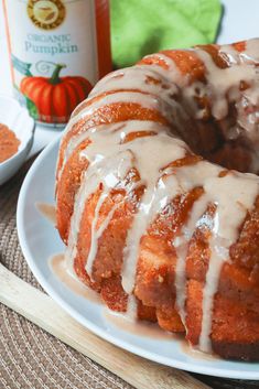 a bundt cake with white icing on a plate