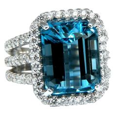 15.00ct. Natural Emerald cut Swiss Blue Topaz Ring Topaz: 14 x 11.5mm Emerald Full cut brilliant Transparent and Clean Clarity 2.40ct. Side natural round white diamonds: G- Color, Vs-2 clarity. 14kt. White gold 13.5 grams Ring Current size: 6 Depth of ring: 8.8mm $7000 Appraisal Will accompany. Luxury White Gold Octagon Topaz Ring, Luxury Octagon Brilliant Cut Topaz Ring, Grad Rings, Stunning Aesthetic, Swiss Blue Topaz Ring, Blue Diamond Ring, Blue Diamonds, Diamond Jewelry Designs, Diamonds Ring