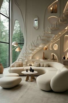 a living room filled with white furniture and lots of windows next to a spiral staircase