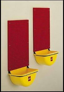 two red and yellow wall hangings on the side of a white wall next to each other