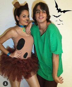 a man and woman dressed up in costumes