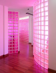 the room is filled with pink shelves and shelvings that are lined up against the wall