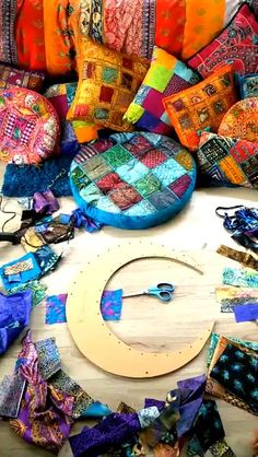 many different colored pieces of fabric on a table