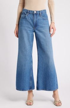 Sport a vintage-chic vibe in these faded nonstretch-denim jeans made with a high waist and full-length wide legs that have a slight flare. 27 1/2" inseam; 29" leg opening; 11 1/2" front rise; 14" back rise (size 29P) Zip fly with button closure Five-pocket style 100% recycled cotton Machine wash, dry flat Imported Denim Blue Flares With Five Pockets For Spring, Light Wash Wide Leg Flares For Spring, Chic Wide Leg Faded Bottoms, Chic Faded Wide Leg Bottoms, Fall Medium Wash Wide Leg Flares, Retro Cropped Jeans For Spring, Faded Cropped Leg Flare Jeans For Fall, Chic Faded Flare Jeans For Spring, Chic Denim Flares For Spring