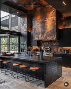 a large kitchen with an island in the middle and lots of stools around it