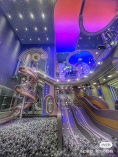 the inside of a building with an indoor slide