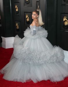 lady in white gown on red carpet at awards