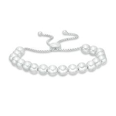 Dress her wrist in the luxury of this beaded bolo bracelet. Crafted in sterling silver, this shimmering design features a bright row of high-polish beads. She can wear one, two or more to create a look all her own. Buffed to a brilliant luster, this easy-on box chain bracelet adjusts up to 9.0 inches in length and secures with a bolo clasp and ball ends. Adjustable Tennis Bracelet For Everyday, Adjustable Silver Tennis Bracelet For Everyday, Elegant Beaded Bracelets With Sliding Knot, Adjustable White Gold Beaded Bracelets, Adjustable White Gold Beaded Bracelet, Adjustable Sterling Silver Tennis Bracelet In White Gold, Classic Beaded Bracelets With Polished Beads, Silver Jewelry With Sliding Knot For Everyday, Classic Polished Beaded Bracelets