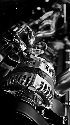 the engine of a car is shown in this black and white photo - like image