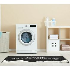 a white washer sitting next to a dryer in a room