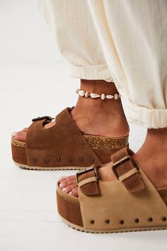 Turn heads in these so bold and statement-making sandals featured in a slip-on style and two-strap design with a chunky flatform sole, studded embellishments, and buckle detailing. * Open-toe design * Molded cork footbed * Wood hand carved base | Rule Breaker Flatform Sandals by Intentionally Blank at Free People in Brown, Size: EU 39 Chunky Summer Sandals, Teva Flatform, Birkenstock Madrid Big Buckle, Free People Sandals, Rule Breaker, Cork Sandals, Free People Shoes, Wrap Sandals, Beaded Sandals