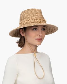 Tucson is a designer woman's sunhat for sale made of Squishee®. The modified Western shape has a fringe-edged band and a self-bolo braid chin strap with a wood bead to adjust and secure it. The signature logo rivet is discretely placed at the back of the crown. The wired brim permits shaping; push up the sides for more Western flare, or flatten them out for additional shade. Squishee® is a man-made material incorporating recycled fibers. It looks and feels just like natural raffia but has the ad A Wood, Signature Logo, Tucson, Straw Hat, Wood Beads, Ultra Violet, Sun Hats, Straw, Braids