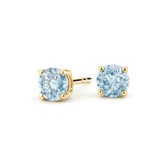 Aquamarine Stud Earrings. These classic and stylish earrings feature serene blue aquamarines secured in classic four-prong basket settings with comfortable push back posts for pierced ears. Classic Blue Topaz Yellow Gold Earrings, Classic Yellow Gold Blue Topaz Earrings, Classic Round Blue Topaz Earrings, Classic Light Blue Brilliant Cut Jewelry, Classic Blue Topaz Birthstone Earrings, Aquamarine Studs, Yellow Gold Solitaire, Stylish Earrings, Stylish Earring