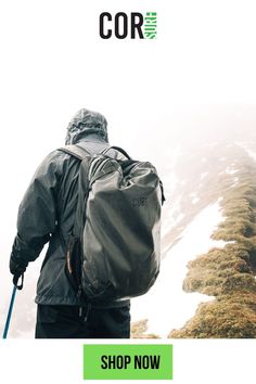 a man with a backpack walking up a mountain