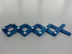 four pieces of blue plastic with white dots on them