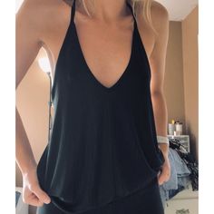 Plain Black Racer Back Tank, Super Stretchy And Comfy. Like Brand New Just Doesn’t Have Tags. Never Worn. Size Xs But Can Definitely Fit A Small. #Freepeopleintamitely Black Halter Top With Built-in Bra For Spring, Black Summer Tops With Built-in Bra, Black Top With Built-in Bra For Day Out, Chic Black V-neck Halter Top, Trendy Black Racerback Halter Top, Summer Racerback Tops For Night Out, Casual Backless Top For Date Night, Casual Black Racerback Halter Top, Black Backless Tank Top For Beach