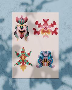 an assortment of decorative stickers on a sheet of paper with shadows from the background