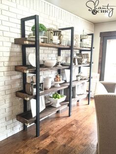 the shelves are filled with plates and bowls