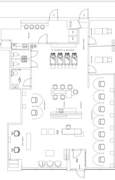 the floor plan for an office with furniture